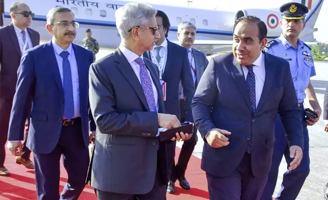 In this photo released by the Press Information Department, India's Minister for External Affairs Subrahmanyam Jaishankar, second left, is greeted by a Pakistani official upon his arrival at an airbase in Rawalpindi, Pakistan, Tuesday, Oct. 15, 2024. (Press Information Department via AP)