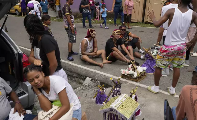 Pilgrims crawl to San Felipe Church to honor the Black Christ in Portobelo, Panama, Monday, Oct. 21, 2024, during a festival celebrating the iconic statue that was found on the shore in 1658. (AP Photo/Matias Delacroix)