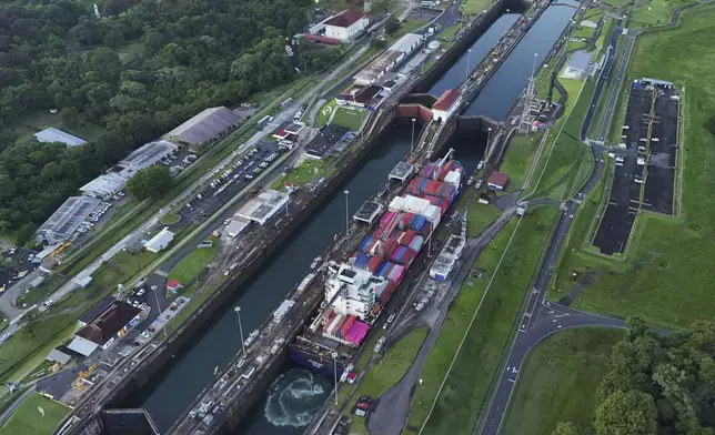 A cargo ship traverses the Agua Clara Locks of the Panama Canal in Colon, Panama, Monday, Sept. 2, 2024. (AP Photo/Matias Delacroix)