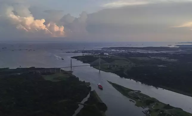 A ship passes through the Agua Clara Locks of the Panama Canal in Colon, Panama, Monday, Sept. 2, 2024. (AP Photo/Matias Delacroix)