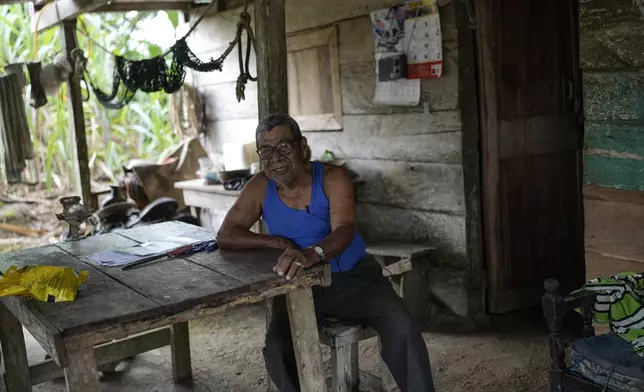 Olegario Hernandez gives an interview at his home in Limon, Panama, Saturday, Aug. 31, 2024. Limon could be submerged in a proposed plan to dam the nearby Indio River to secure the Panama Canal’s uninterrupted operation. (AP Photo/Matias Delacroix)