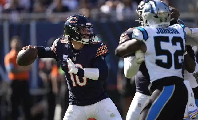 Chicago Bears quarterback Caleb Williams (18) throws against the Carolina Panthers during the second half of an NFL football game Sunday, Oct. 6, 2024, in Chicago. (AP Photo/Charles Rex Arbogast)