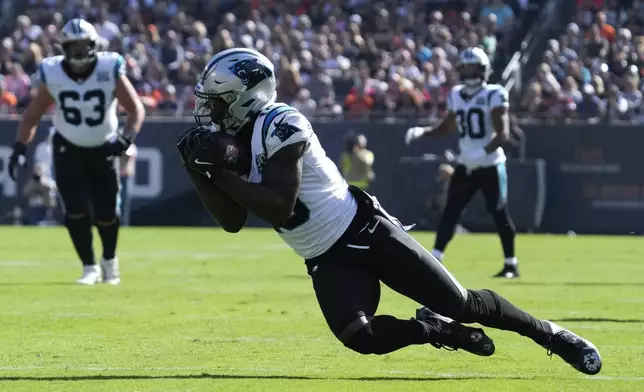 Carolina Panthers wide receiver Jonathan Mingo (15) catches a pass against the Chicago Bears during the second half of an NFL football game Sunday, Oct. 6, 2024, in Chicago. (AP Photo/Nam Y. Huh)