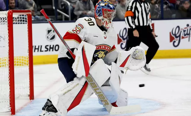 Florida Panthers' Spencer Knight makes a save against the Columbus Blue Jackets during the second period of an NHL hockey game Tuesday, Oct. 15, 2024, in Columbus, Ohio. (AP Photo/Jay LaPrete)