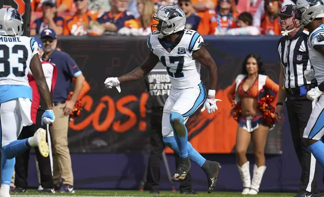 Carolina Panthers wide receiver Xavier Legette (17) celebrates his touchdown during the first half of an NFL football game against the Denver Broncos, Sunday, Oct. 27, 2024, in Denver. (AP Photo/Jack Dempsey)