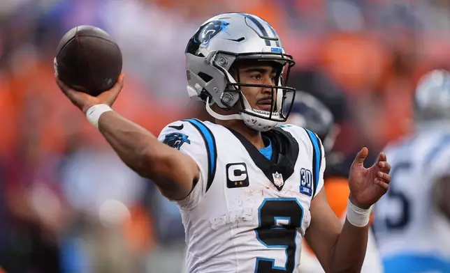 Carolina Panthers quarterback Bryce Young looks to throw a pass late in the second half of an NFL football game against the Denver Broncos, Sunday, Oct. 27, 2024, in Denver. (AP Photo/David Zalubowski)