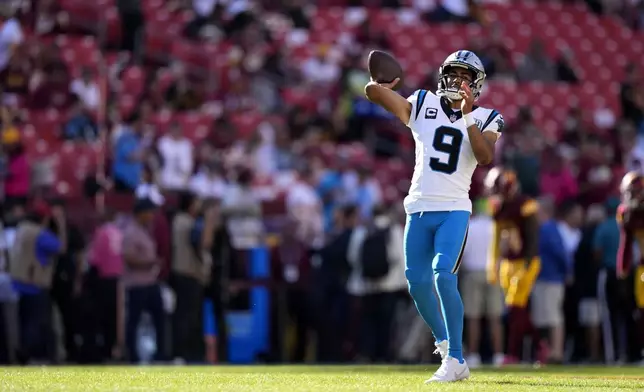 Carolina Panthers quarterback Bryce Young warms up before an NFL football game against the Washington Commanders, Sunday, Oct. 20, 2024, in Landover, Md. (AP Photo/Stephanie Scarbrough)