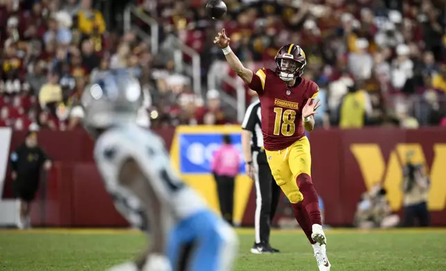 Washington Commanders quarterback Marcus Mariota throws a pass during the second half of an NFL football game against the Carolina Panthers, Sunday, Oct. 20, 2024, in Landover, Md. (AP Photo/Stephanie Scarbrough)