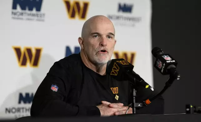 Washington Commanders head coach Dan Quinn speaks during a news conference after an NFL football game against the Carolina Panthers, Sunday, Oct. 20, 2024, in Landover, Md. The Commanders 40-7. (AP Photo/Nick Wass)