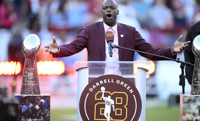Former Washington defensive back Darrell Green speaks during a jersey retirement ceremony at halftime of an NFL football game between the Washington Commanders and the Carolina Panthers, Sunday, Oct. 20, 2024, in Landover, Md. (AP Photo/Nick Wass)