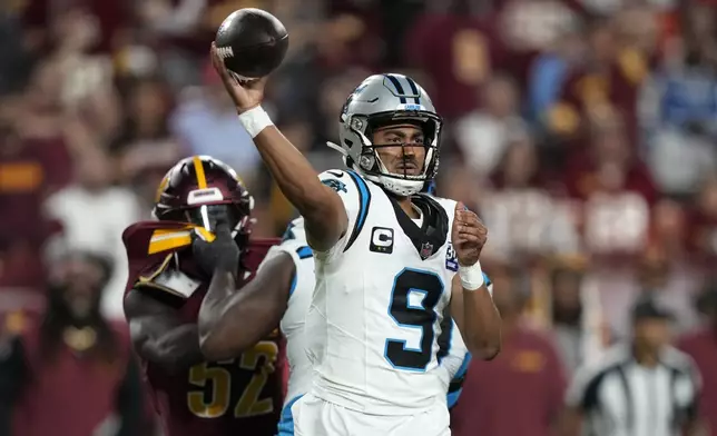 Carolina Panthers quarterback Bryce Young throws a pass during the second half of an NFL football game against the Washington Commanders, Sunday, Oct. 20, 2024, in Landover, Md. (AP Photo/Stephanie Scarbrough)