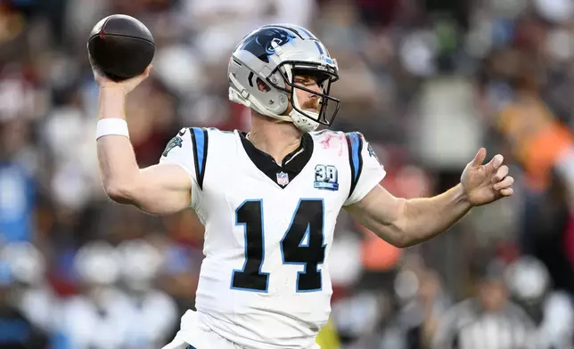 Carolina Panthers quarterback Andy Dalton throws a pass during the second half of an NFL football game against the Washington Commanders, Sunday, Oct. 20, 2024, in Landover, Md. (AP Photo/Nick Wass)