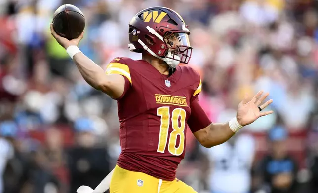 Washington Commanders quarterback Marcus Mariota throws a pass during the first half of an NFL football game against the Carolina Panthers, Sunday, Oct. 20, 2024, in Landover, Md. (AP Photo/Nick Wass)