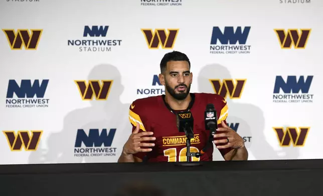 Washington Commanders quarterback Marcus Mariota speaks during a news conference after an NFL football game against the Carolina Panthers, Sunday, Oct. 20, 2024, in Landover, Md. The Commanders 40-7. (AP Photo/Nick Wass)