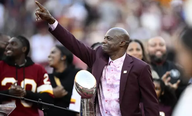 Former Washington defensive back Darrell Green reacts during a jersey retirement ceremony at halftime of an NFL football game between the Washington Commanders and the Carolina Panthers, Sunday, Oct. 20, 2024, in Landover, Md. (AP Photo/Nick Wass)