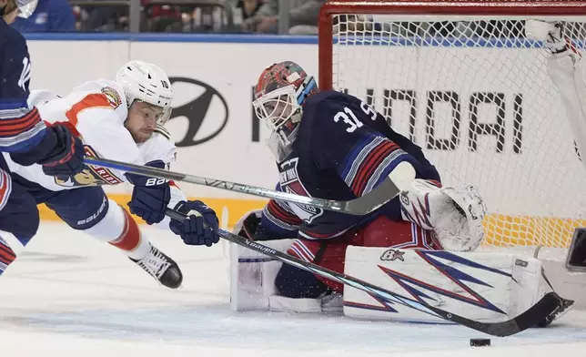 New York Rangers goaltender Igor Shesterkin (31) stops a shot by Florida Panthers' A.J. Greer (10) during the second period of an NHL hockey game Thursday, Oct. 24, 2024, in New York. (AP Photo/Frank Franklin II)