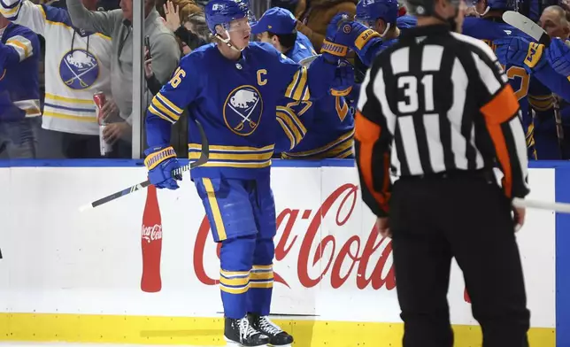 Buffalo Sabres defenseman Rasmus Dahlin (26) celebrates his goal during the second period of an NHL hockey game against the Florida Panthers, Monday, Oct. 28, 2024, in Buffalo, N.Y. (AP Photo/Jeffrey T. Barnes)