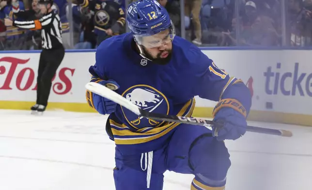 Buffalo Sabres left wing Jordan Greenway (12) celebrates his goal during the first period of an NHL hockey game against the Florida Panthers, Saturday, Oct. 12, 2024, in Buffalo, N.Y. (AP Photo/Jeffrey T. Barnes)