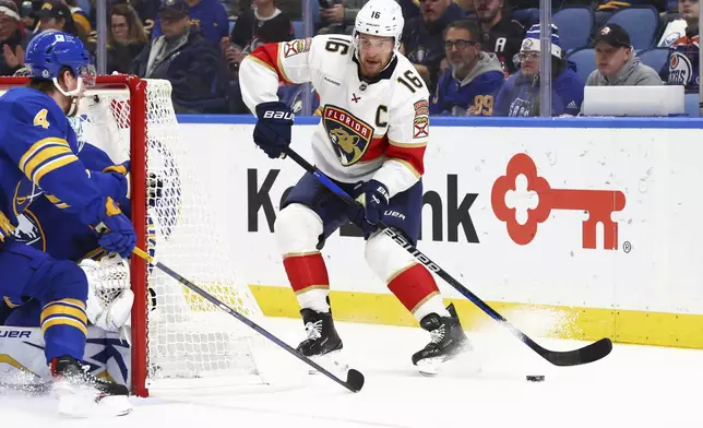 Florida Panthers center Aleksander Barkov (16) looks to pass the puck during the second period of an NHL hockey game against the Buffalo Sabres, Monday, Oct. 28, 2024, in Buffalo, N.Y. (AP Photo/Jeffrey T. Barnes)