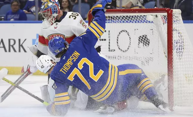 Buffalo Sabres center Tage Thompson (72) collides with Florida Panthers goaltender Spencer Knight (30) during the first period of an NHL hockey game, Saturday, Oct. 12, 2024, in Buffalo, N.Y. (AP Photo/Jeffrey T. Barnes)