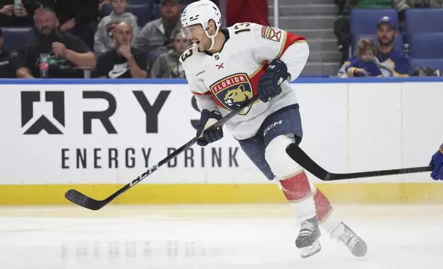 Florida Panthers center Sam Reinhart (13) skates out of the zone during the second period of an NHL hockey game against the Buffalo Sabres, Saturday, Oct. 12, 2024, in Buffalo, N.Y. (AP Photo/Jeffrey T. Barnes)