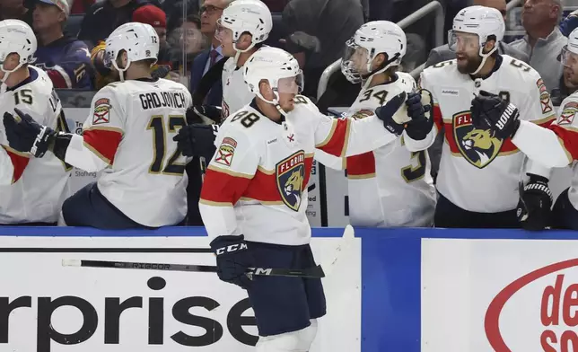 Florida Panthers defenseman Nate Schmidt (88) celebrates his goal during the first period of an NHL hockey game against the Buffalo Sabres, Saturday, Oct. 12, 2024, in Buffalo, N.Y. (AP Photo/Jeffrey T. Barnes)