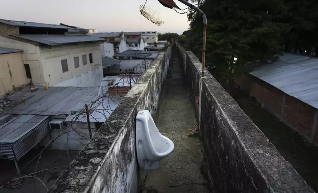 A urinal is located along an observation walkway for security guards at the Tacumbu prison in Asuncion, Paraguay, Sunday, July 8, 2024. (AP Photo/Rodrigo Abd)