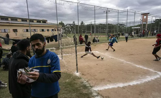 Prisoners play soccer at the Juan de la Vega prison in Emboscada, Paraguay, Friday, July 12, 2024. (AP Photo/Rodrigo Abd)