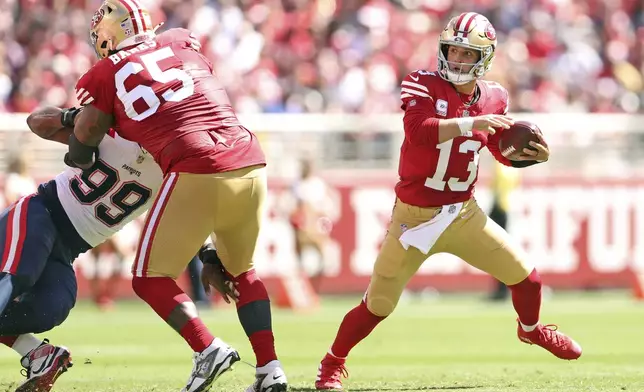 San Francisco 49ers' Brock Purdy scrambles for a first down during an NFL football game against New England Patriots in Santa Clara, Calif., Sunday, Sept. 29, 2024. (Scott Strazzante/San Francisco Chronicle via AP)