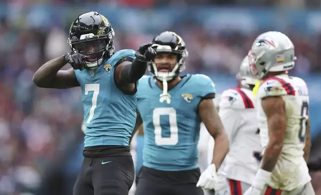 Jacksonville Jaguars wide receiver Brian Thomas Jr. (7) reacts after his pass reception for a first down during the first half of an NFL football game against the New England Patriots, Sunday, Oct. 20, 2024, in London. (AP Photo/Ian Walton)