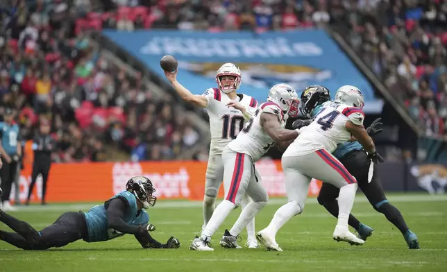 New England Patriots quarterback Drake Maye (10) throws during the first half of an NFL football game against the Jacksonville Jaguars, Sunday, Oct. 20, 2024, in London. (AP Photo/Kin Cheung)