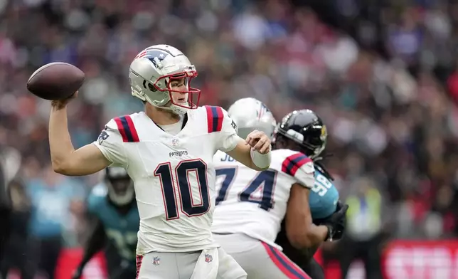 New England Patriots quarterback Drake Maye (10) throws during the first half of an NFL football game against the Jacksonville Jaguars, Sunday, Oct. 20, 2024, in London. (AP Photo/Kin Cheung)