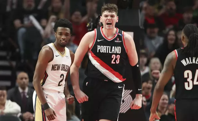 Portland Trail Blazers center Donovan Clingan (23) reacts during the second half of an NBA basketball game against the New Orleans Pelicans, Friday, Oct. 25, 2024, in Portland, Ore. (AP Photo/Amanda Loman)