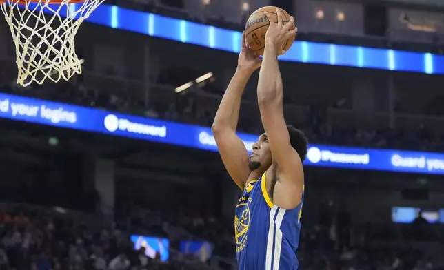 Golden State Warriors forward Trayce Jackson-Davis dunks against the New Orleans Pelicans during the first half of an NBA basketball game in San Francisco, Wednesday, Oct. 30, 2024. (AP Photo/Jeff Chiu)