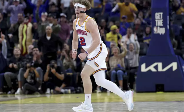 Golden State Warriors guard Brandin Podziemski (2) celebrates against the New Orleans Pelicans during the first half of an NBA basketball game in San Francisco, Tuesday, Oct. 29, 2024. (AP Photo/Jed Jacobsohn)