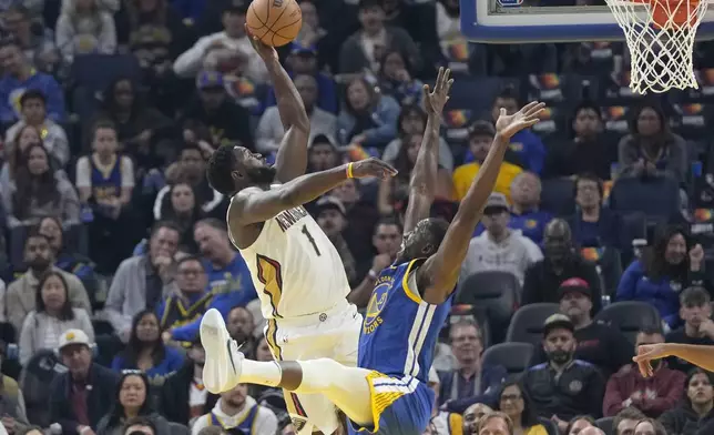 New Orleans Pelicans forward Zion Williamson (1) shoots against Golden State Warriors forward Draymond Green during the first half of an NBA basketball game in San Francisco, Wednesday, Oct. 30, 2024. (AP Photo/Jeff Chiu)