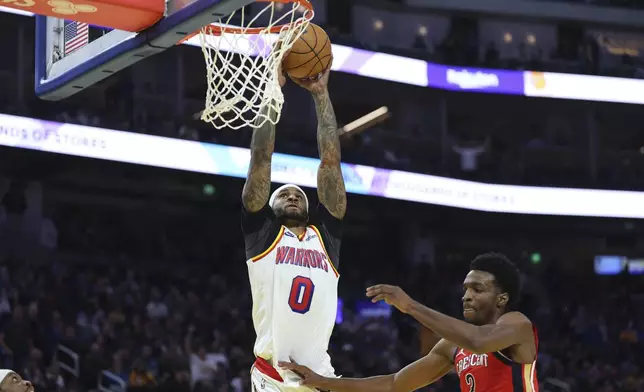 Golden State Warriors guard Gary Payton II (0) shoots over New Orleans Pelicans forward Herbert Jones (2) during the first half of an NBA basketball game in San Francisco, Tuesday, Oct. 29, 2024. (AP Photo/Jed Jacobsohn)