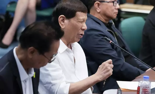 Former Philippine President Rodrigo Duterte gestures during a Senate investigation on the war on the drugs during his administration at the Philippine Senate, Monday, Oct. 28, 2024, in Manila, Philippines. (AP Photo/Aaron Favila)