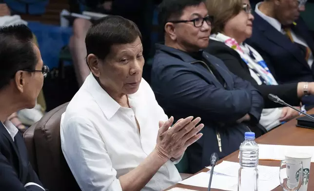 Former Philippine President Rodrigo Duterte listens during a senate investigation on the war on the drugs during his administration, at the Philippine Senate, Monday, Oct. 28, 2024, in Manila, Philippines. (AP Photo/Aaron Favila)