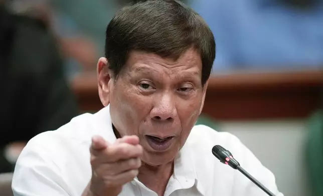 Former Philippine President Rodrigo Duterte gestures during a Senate investigation on the war on the drugs during his administration at the Philippine Senate Monday, Oct. 28, 2024, in Manila, Philippines. (AP Photo/Aaron Favila)