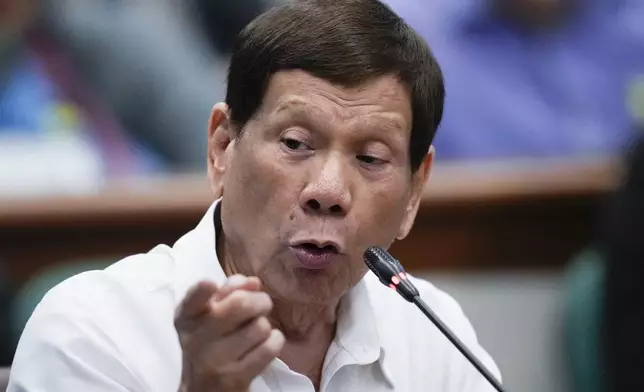 Former Philippine President Rodrigo Duterte speaks during a senate investigation on the war on the drugs during his administration, at the Philippine Senate, Monday, Oct. 28, 2024, in Manila, Philippines. (AP Photo/Aaron Favila)