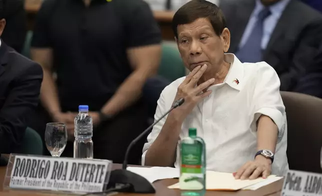 Former Philippine President Rodrigo Duterte listens during a senate inquiry on the so-called war on drugs during his administration at the Philippine Senate Monday, Oct. 28, 2024, in Manila, Philippines. (AP Photo/Aaron Favila)