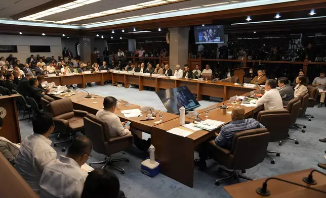 Philippine Senator Aquilino Pimentel III, right seated, leads a senate investigation on the so-called war on drugs during the administration of former Philippine President Rodrigo Duterte at the Philippine Senate Monday, Oct. 28, 2024, in Manila, Philippines. (AP Photo/Aaron Favila)