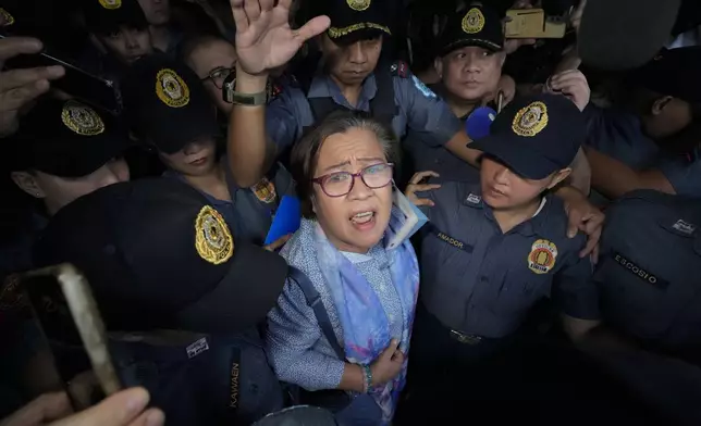 FILE- Former Senator Leila de Lima, one of the most vocal critics of former president Rodrigo Duterte, leaved the Muntinlupa City trial court after she was released on bail on Monday, Nov. 13, 2023 in Muntinlupa, Philippines. (AP Photo/Aaron Favila, File)