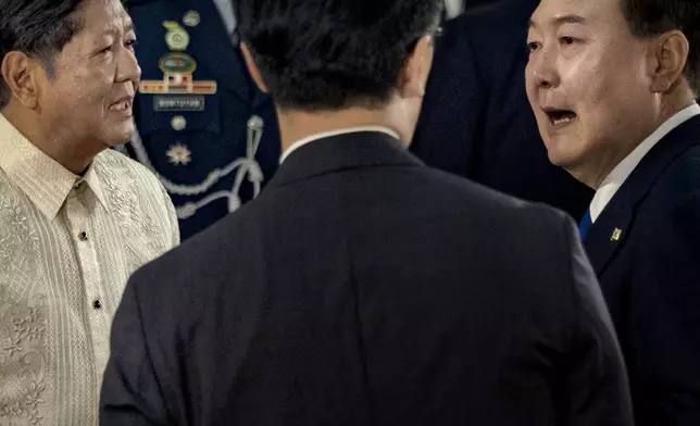 Philippine President Ferdinand Marcos Jr., left, meets with South Korean President Yoon Suk Yeol at the Malacanang Palace Monday, Oct. 7, 2024 in Manila, Philippines. (Ezra Acayan/Pool Photo via AP)