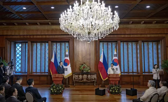 Philippine President Ferdinand Marcos Jr., right, delivers a speech during his meeting with South Korean President Yoon Suk Yeol at the Malacanang Palace Monday, Oct. 7, 2024 in Manila, Philippines. (Ezra Acayan/Pool Photo via AP)