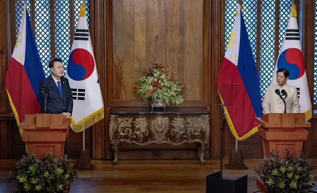 Philippine President Ferdinand Marcos Jr., right, delivers a speech during his meeting with South Korean President Yoon Suk Yeol at the Malacanang Palace Monday, Oct. 7, 2024 in Manila, Philippines. (Ezra Acayan/Pool Photo via AP)