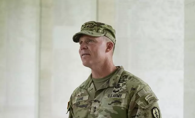 U.S. Maj. Gen. Marcus Evans, commanding general of the U.S. Army's 25th Infantry Division looks at names of American soldiers who died during World War II that are carved on a wall at the Manila American Cemetery and Memorial in Taguig, Philippines Monday, Oct. 21, 2024. (AP Photo/Aaron Favila)