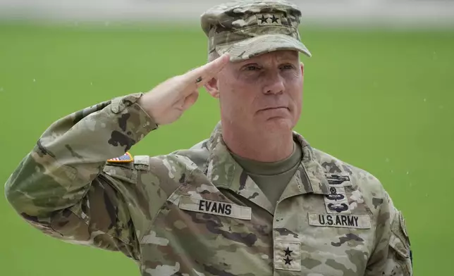 U.S. Maj. Gen. Marcus Evans, commanding general of the U.S. Army's 25th Infantry Division, salutes during a wreath laying rite to honor American soldiers died during World War II at the Manila American Cemetery and Memorial in Taguig, Philippines Monday, Oct. 21, 2024. (AP Photo/Aaron Favila)