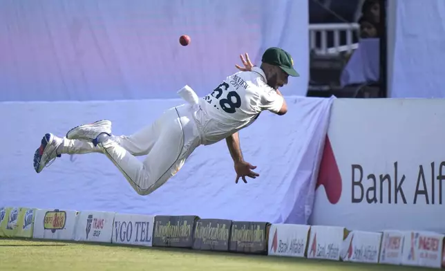 Pakistan's Sajid Khan attempts to take a catch of England's Jamie Smith on the boundary edge during the day one of third test cricket match between Pakistan and England, in Rawalpindi, Pakistan, Thursday, Oct. 24, 2024. (AP Photo/Anjum Naveed)